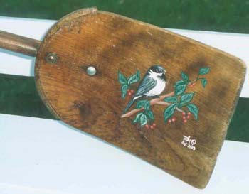 Chickadee on an antique shovel